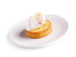 Lemon tartlet with meringue on plate photo