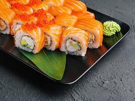 Philadelphia roll sushi with salmon, prawn, avocado, cream cheese photo