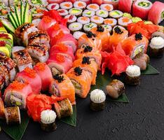 Large sushi set on a black stone photo