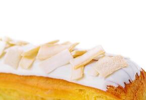 Eclair with white chocolate close up photo