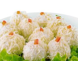 Cheese balls with garlic and mayonnaise on lettuce leaf photo