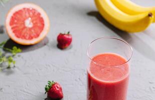 Fresh grapefruit juice in a glass photo