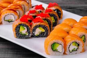 varios Philadelphia sushi rolls with salmon on a plate photo