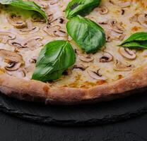 Mushroom pizza with cheese and basil photo