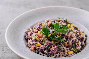 Fresh red cabbage salad with corn photo