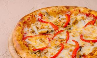 Delicious pizza with chicken, pepper and mushrooms photo