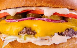 Tasty and appetizing hamburger cheeseburger macro photo