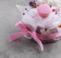 Easter cake decorated with meringues and macarons photo