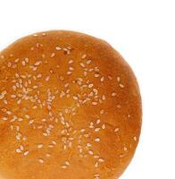 Fresh burger bun with sesame seeds isolated on top view photo