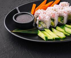 sushi rolls with crab sticks and cucumbers photo