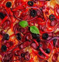 Pizza with Bavarian sausages with bell pepper and red onion photo