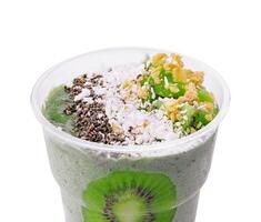 Smoothie with kiwi, coconut, granola and chia seeds photo