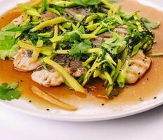 Fried fish fillet. cod with sauce and herbs photo