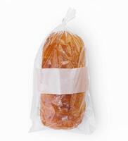 un pan en celofán bolso en blanco antecedentes foto