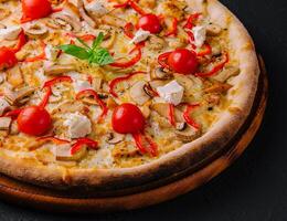 Pizza with chicken and tomatoes photo