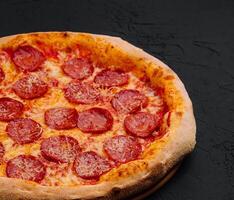 Pizza with pepperoni and parmesan photo