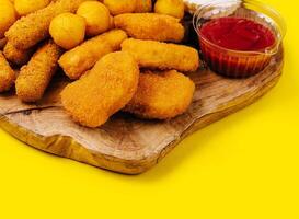 nuggets and cheese balls with sauces photo