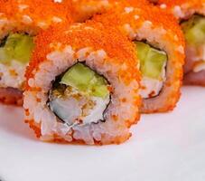 Macro shot of california maki sushi rolls with rice photo