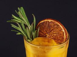 Cold season drink - orange and rosemary cocktail photo