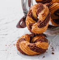 Chocolate cookies in a glass jar opened photo