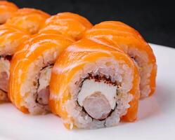 Sushi roll philadelphia with salmon and shrimps photo