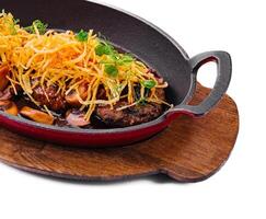 steak with mushrooms and onion chips photo