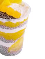 Chia pudding with pineapple isolated on white photo