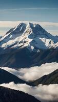 ai generado un montaña rango con nieve tapado picos y nubes foto