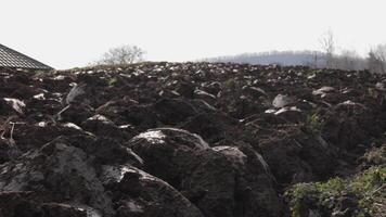 plowed soil in a field in a mountainous area in preparation for sowing, an agricultural field in which the soil is plowed but nothing grows video