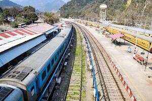 Kathgodam, Uttarakhand, India, September 25 2023 - Indian railway train at Kathgodam railway station platform during morning time, Colourful train at Kathgodam, Uttarakhand railway station photo