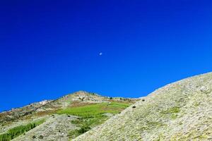 Small Moon In Early Morning Blue Sky photo