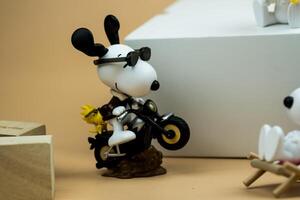 BANGKOK, THAILAND - March 9, 2024 A toy of Snoopy, Motorcycle energy. photo