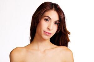 Bare Shoulder Portrait Of Slim Hispanic Woman On White photo