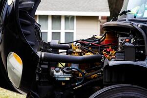 Carmichael, CA, 2015 - Truck Engine Hoses And Wires With House In Background photo