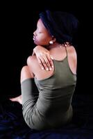 Attractive Young African American Woman Sitting Green Dress photo