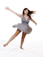 Young Asian American Woman Spinning In Dress photo