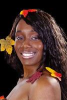 Attractive African American Woman Autumn Leaves Portrait photo
