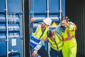 Engineer wear PPE urgently assisted the male technique inside container as Chemical spill in the container shipping industry photo