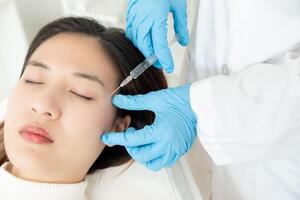 Cosmetic surgery, skin whitening injection, filler injection, Skin reface, beautiful Asian girls receive beauty treatments at beauty clinic, skincare, pore rejuvenation, wrinkle, baby face photo