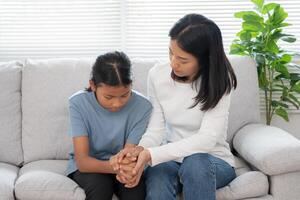 asian mother support daughter discussing study problems. Parent encourages and empathy child suffers depression. psychological, trust, care, cry, expectation, teen problems, bullying, learn problem photo