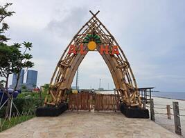 jakarta, indonesia - january 30th 2024 The iconic bamboo monument pantai indah kapuk - aloha photo