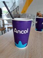 jakarta indonesia january 31th 2024 purple cola and tea drinking cups that say in the ancol recreation park photo