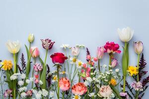 ai generado vibrante manojo de clasificado flores en prístino suave antecedentes foto