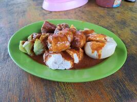 Siomay is a typical Indonesian food made from cabbage, potatoes, eggs, bitter melon and tofu boiled in peanut sauce macro photography photo