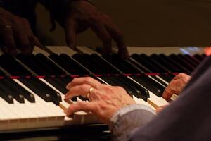 Fair Oaks, CA, 2014 - Hands Playing Grand Piano Keys Tight Shot photo