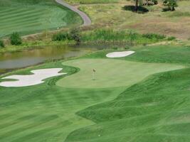 Klamath Falls, OR, 2005 - Empty Green On Golf Course With Sand Traps And Pond photo