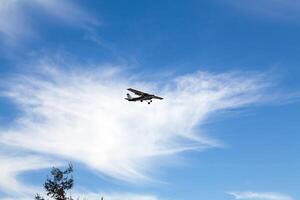 Watsonville, CA, 2011 - Single prop private plane heading for landing photo