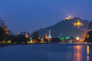 Night view of Mandalay palace and Mandalay Hill in Myanmar Burma photo