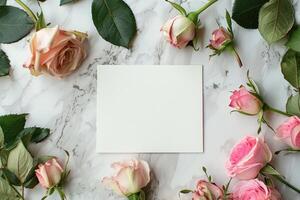 ai generado burlarse de arriba de blanco tarjeta en mármol mesa con primavera rosado rosas parte superior vista. vacío blanco tarjeta postal modelo para contento madre y mujer día saludos. plano laico Boda invitaciones con Copiar espacio foto