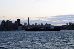 San Francisco, CA, 2014 - Container Ship On Bay With City Skyline photo